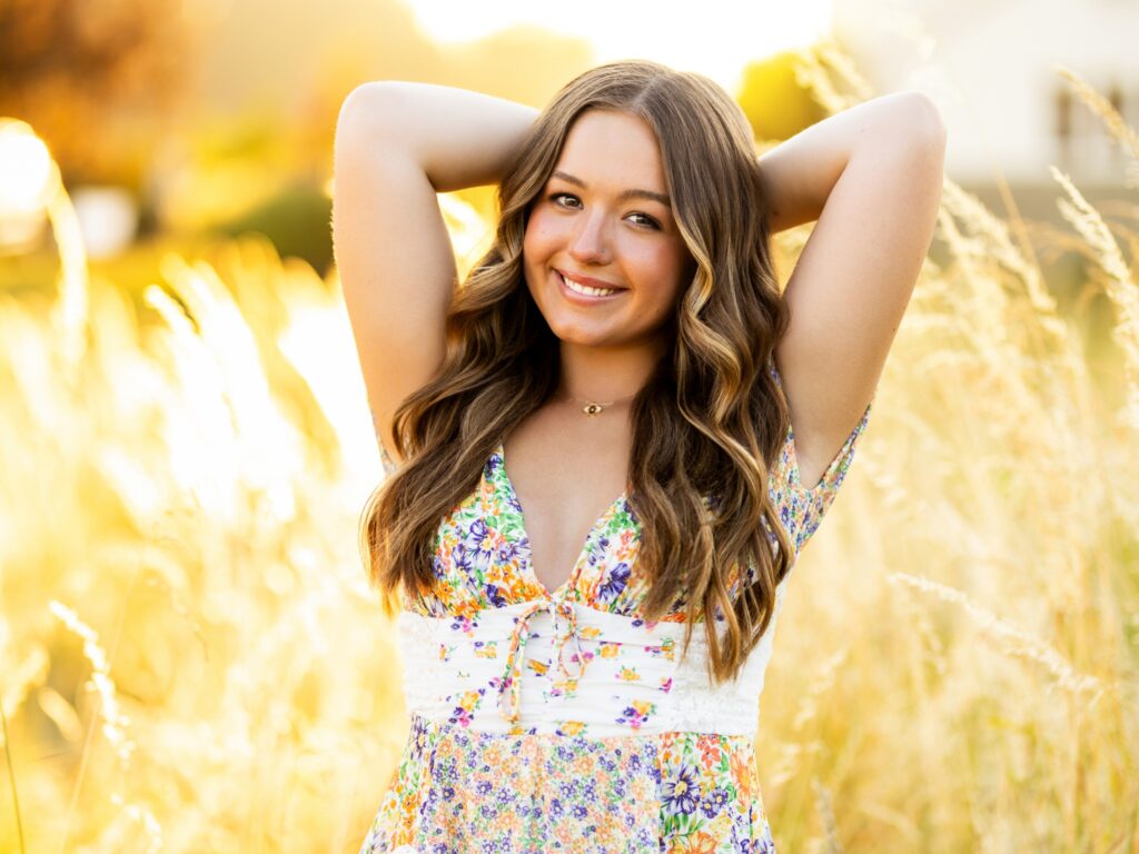 Senior photos in Vancouver Washington and Portland Oregon in the summer in a grassy field with a dress