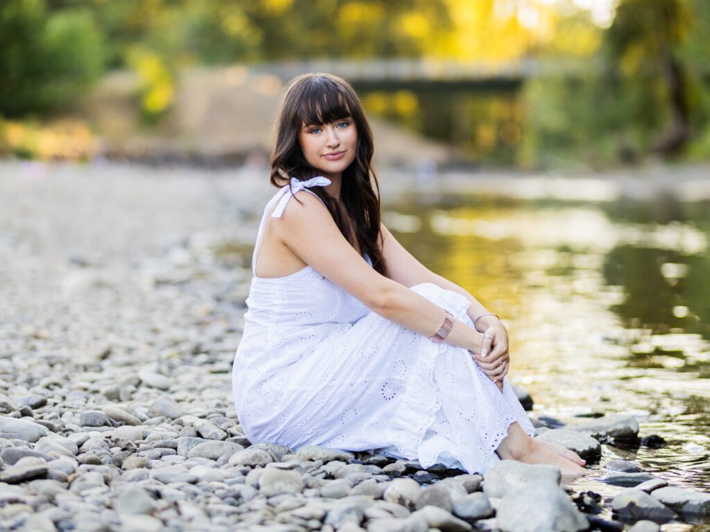 High school senior portraits of a girl by a river in Portland Oregon and Vancouver Washington