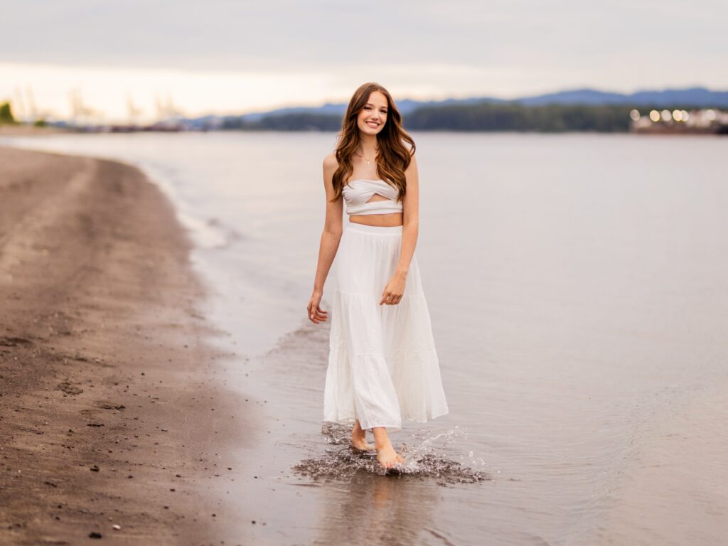 High school senior portraits in downtown Vancouver Washington in a natural setting on a sandy beach by the columbia river
