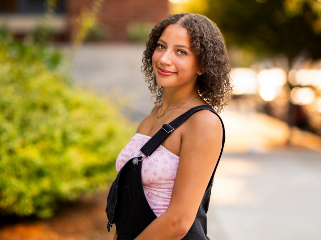 Girl senior photos in Vancouver Washington Lake Oswego, West Linn Oregon and Portland Oregon in the summer in an urban setting wearing a casual outfit with jeans