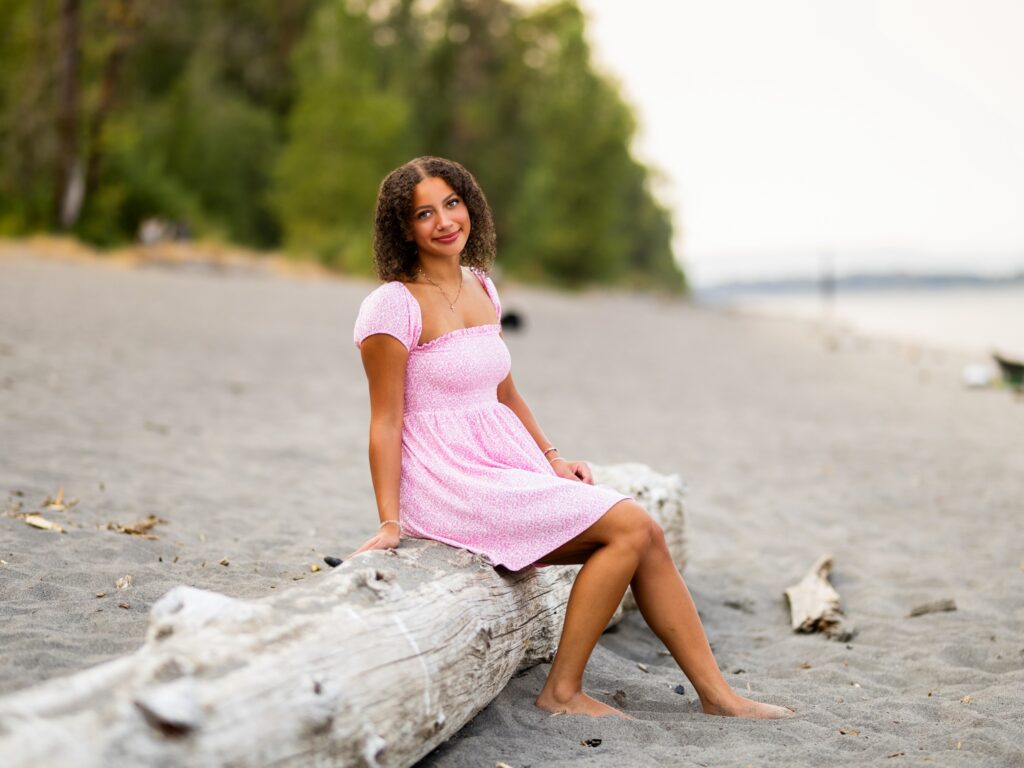 Girl senior photos in Vancouver Washington Lake Oswego, West Linn Oregon and Portland Oregon in the summer next to a river wearing a pink dress at sunset