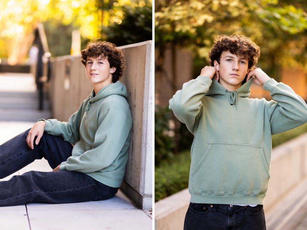Boy senior pictures in downtown Vancouver, WA wearing a sage green hoodie in a modern urban setting.
