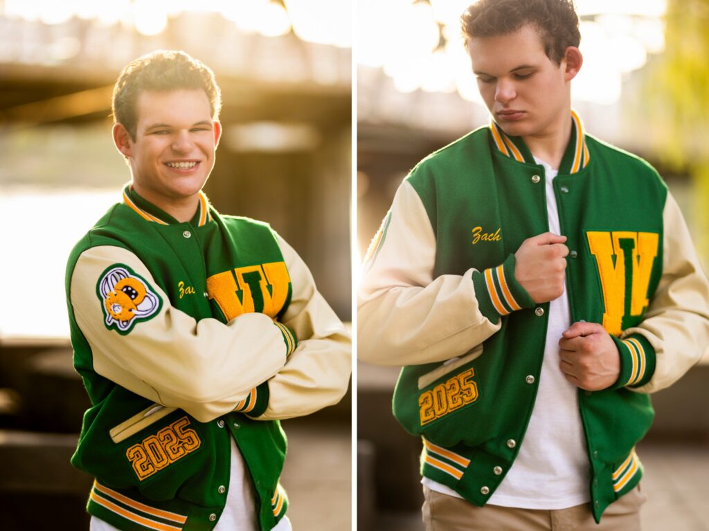 Guy senior photos in Portland, OR during golden hour wearing a green West Linn letterman jacket over a white t-shirt by the waterfront.