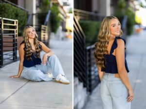 Girl senior photos in downtown Vancouver, WA wearing a navy ruffle top, light wash wide leg jeans, and sneakers beside black metal railings on a city sidewalk.