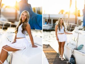 Girl senior photos in Vancouver, WA during golden hour wearing a white crop top and ruffle mini skirt while posing on a sailboat and wooden marina dock.